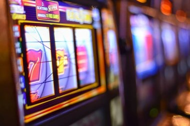 Live dealer revealing cards at moyang Three Card Poker table